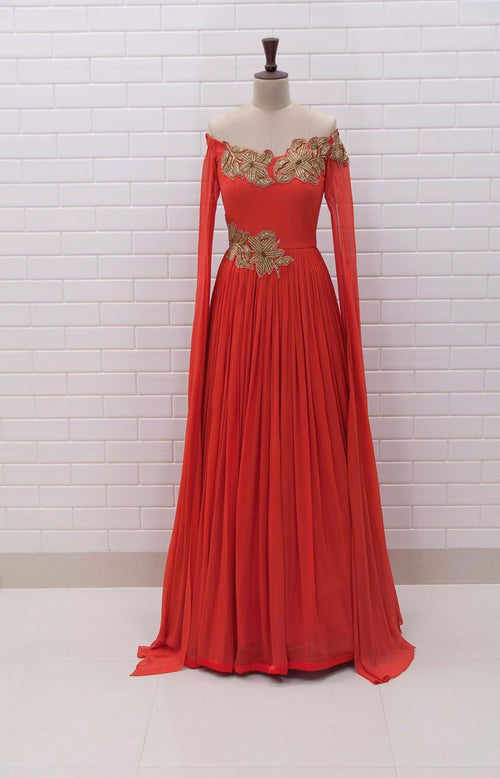 TAZIA : Rust coloured off shoulder long drape sleeves gown with Zardozi embroidery