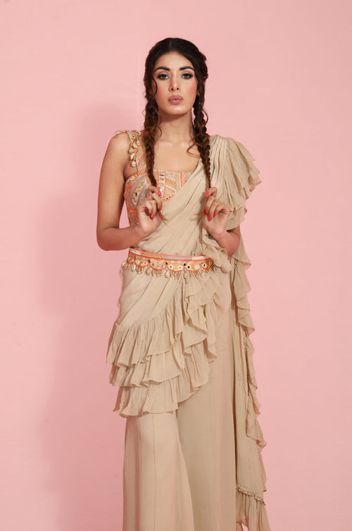 NORIANA : Bohemian inspired Thread and mirror work corset with a Concept ruffle sash saree and bell bottom pants