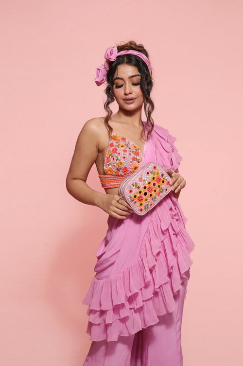 LOYOLA : Ruffle sash concept Saree, styled with a mirror work embroidered Bikini top, ruffle sach draped to look like a saree around Bell bottom pants