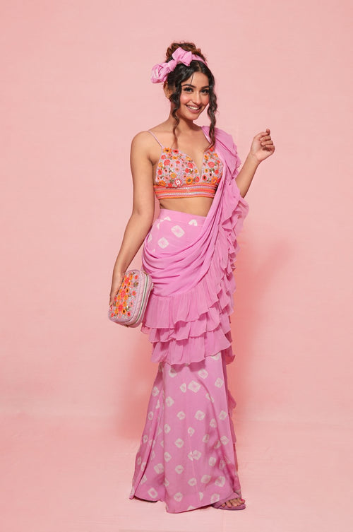 LARA : Ruffle sash concept Saree, styled with a mirror work embroidered Bikini top, ruffle sach draped to look like a saree around hand knotted tie and dyed Bell bottom pants