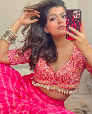 LARA : Ruffle sash concept Saree, styled with a mirror work embroidered Bikini top, ruffle sach draped to look like a saree around hand knotted tie and dyed Bell bottom pants